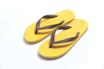 Yellow flip flops isolated on white background