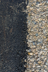 Teer und Steine auf der Strasse