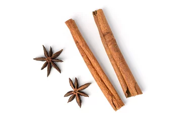 Gordijnen Two brown vegeterian cinnamon sticks lying on white background © ipuwadol