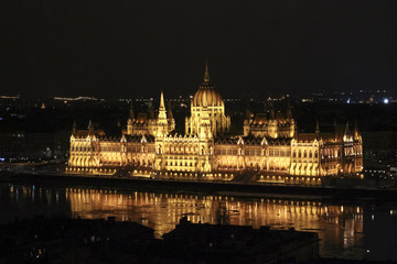 Fototapeta na wymiar Parliament building by night illuminated by lights, Budapest, Hungary