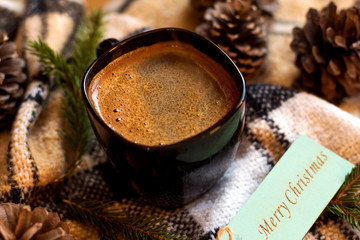 Cup of coffee, cones and candle. Christmas and New Year. Still life.