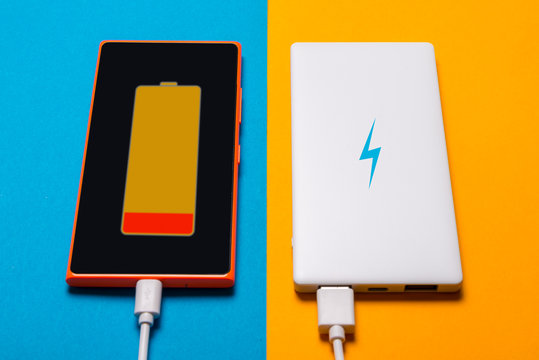 Power bank for smart phone on blue yellow background