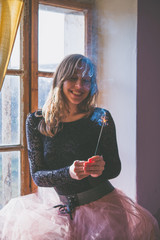 Happy woman with sparkler - New Years party