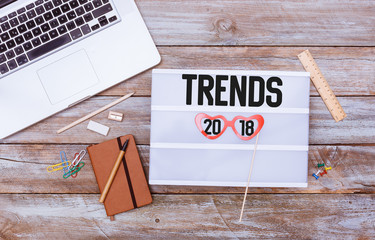 Trends 2018 on light box, office desk flat lay