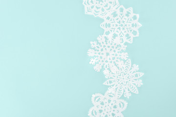 decorative christmas snowflakes, isolated on light blue with copy space