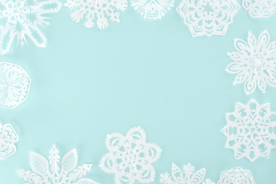 christmas frame with decorative snowflakes, isolated on light blue