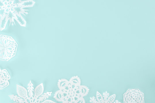 decorative christmas snowflakes, isolated on light blue with copy space
