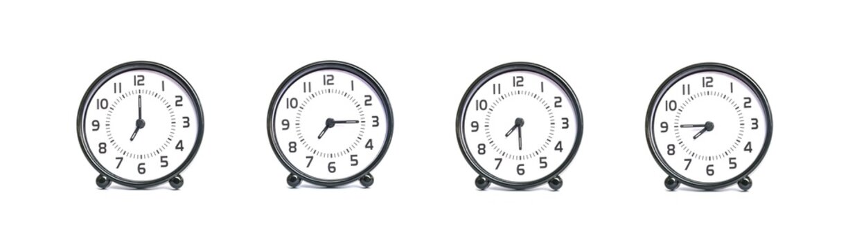 Closeup group of black and white clock for decoration show the time in 7 , 7:15 , 7:30 , 7:45 a.m. isolated on white background