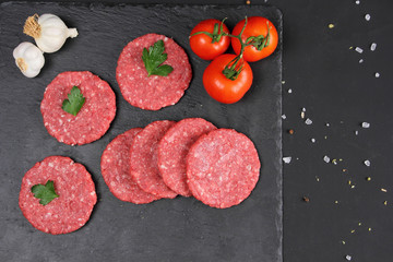 Raw Uncooked Meat Balls on the Black Background
