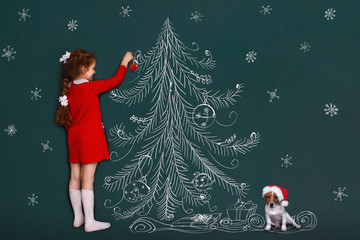 Cute girl and her jack russell dog with decorates a Christmas tree.