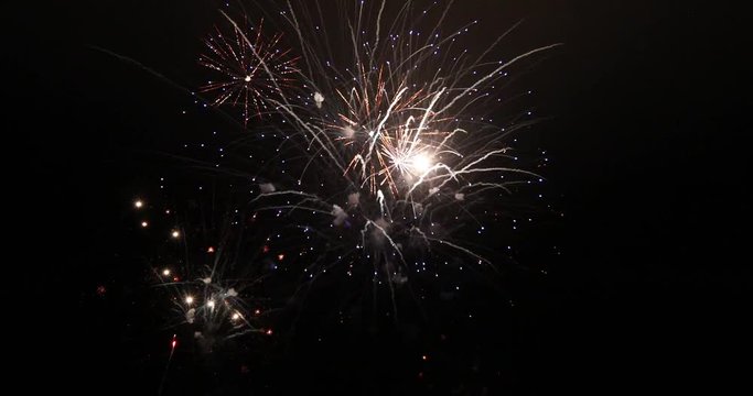 Slow motion of beautiful fireworks separated on black background