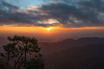 Fototapeta na wymiar Landscape of beautiful sunset, sunrise the sun, fog and cloud are on the top of mountains, favor place for tourism who like hiking or trekking to see view, Doi Langka Lung, Thailand 