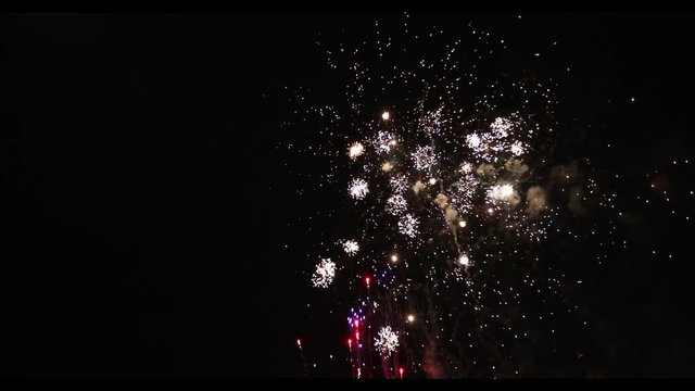 Slow motion of beautiful fireworks separated on black background