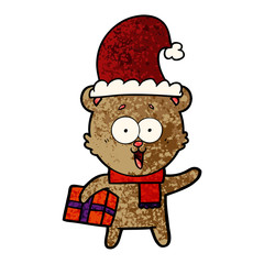 laughing teddy  bear with christmas present