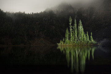 Scenic view of trees reflecting in lake at North Cascades National Park