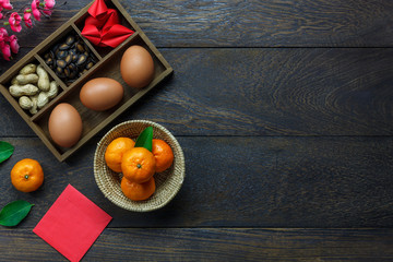 Flat lay of arrangement Chinese new year & lunar background holiday concept. Orange and essential...