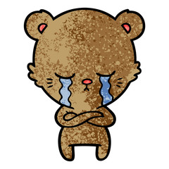 crying cartoon bear with folded arms