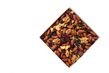 Many different nuts, dried berries isolated on white background. Antioxidant product. Healthy food.