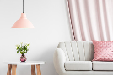 Peach lamp above wooden table