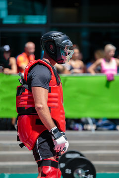 Extreme Sport: People Fighting Outdoors With Red Body Protective Gear