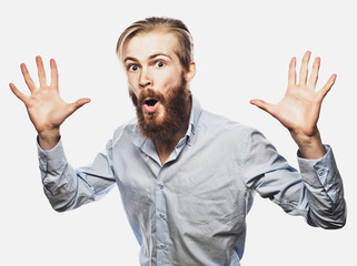 Fototapeta premium Emotional businessman pulls his hands apart, expressing surprise and disappointment. Business concept.