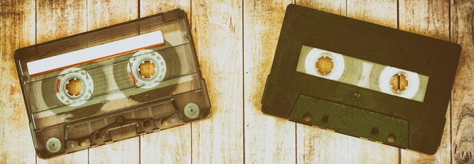 Old cassette tapes with a wooden background