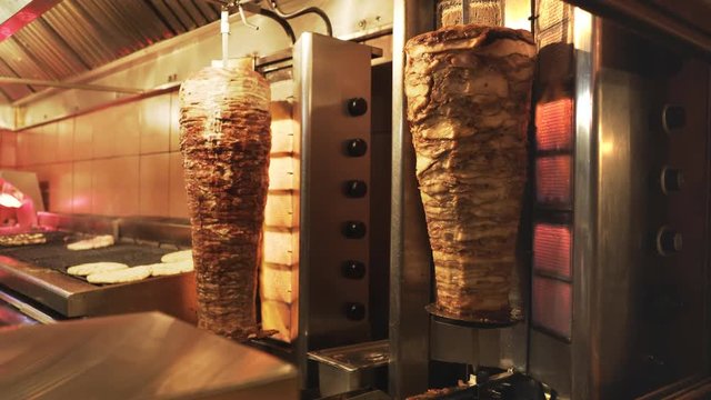 close up of two gyros rotisseries in a restuarant in athens, greece