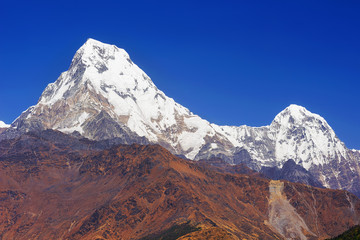 Annapurna South mountain view from Poon Hill with blue sky background. Nepal landscape, Annapurna...