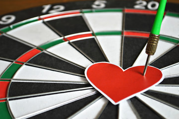 Valentines Day card with heart and arrow on dart board. Love concept