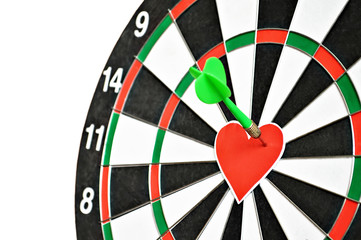 Creative Valentines day or love concept. Heart shape and arrow on dartboard