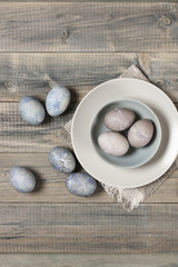 Fototapeta na wymiar Natural dyed grey Easter eggs