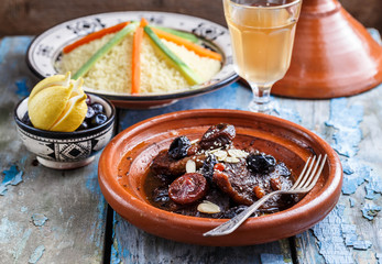 Closeview of tajine of beef with prunes and almonds. In tradiotional Moroccan dish.