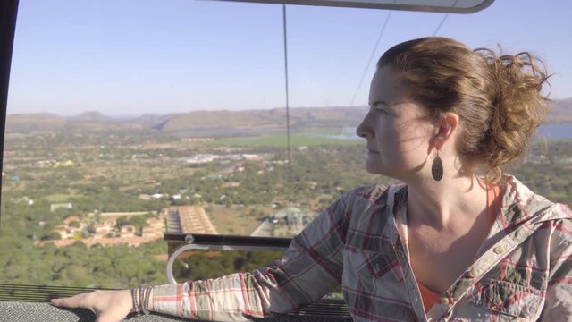 Woman rides cable car down