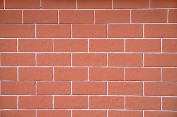 Obraz premium New decorative red plaster imitating cladding slabs