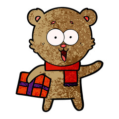 laughing teddy  bear with christmas present