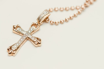 Fototapeta na wymiar Cross with chain on white background