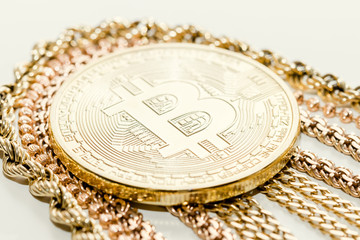 Bitcoin and golden chain on white background