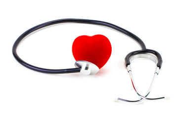 Stethoscope around a red rubber heart on a white background; concept of health, healthy heart, or cardio examination
