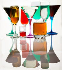 glasses on a white background with different drinks