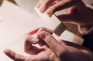 Obraz premium Woman hand polishing nails