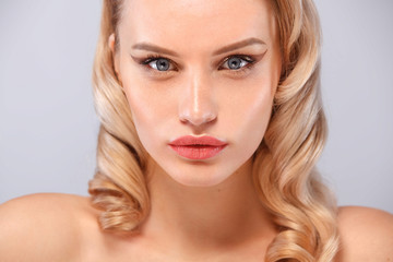 Beauty portrait of female face with natural skin and nude makeup