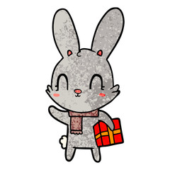 Fototapeta na wymiar cute cartoon rabbit with christmas present