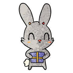 cute cartoon rabbit with present