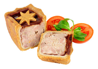 Cranberry sauce topped pork pie decorated with a pastry star isolated on a white background