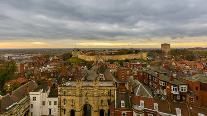 Fototapeta na wymiar East View of Lincoln, England - View from the Cathedral Tower, with Lincoln Castle and Dramatic Cloudscape