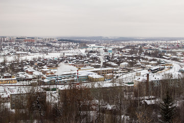 Obraz premium view from the mountain to a snow-clad city