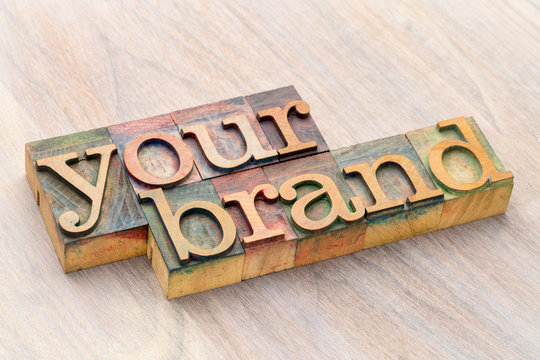 your brand word abstract in wood type