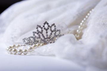 Tiara and white pearls with wedding dress © martina87