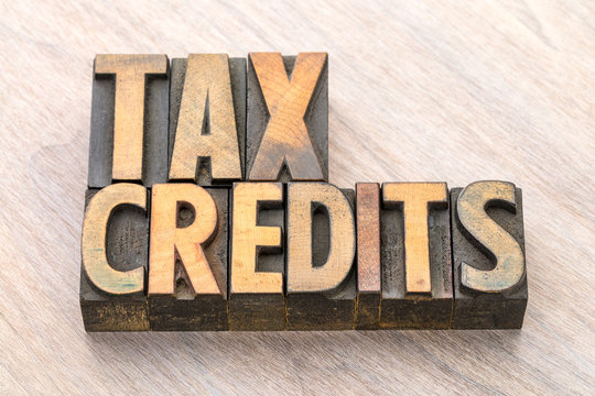 tax credits word abstract in wood type