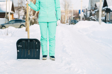 ready to remove snow with a shovel after the snowfall